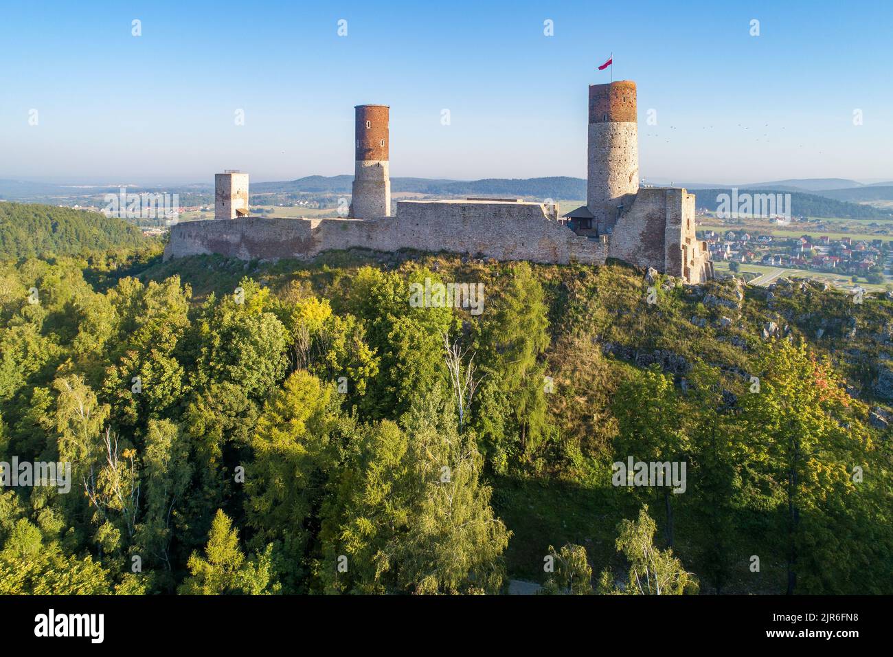 Medieval royal castle in Chęciny near Kielce in Poland. Built in late 13th century. Ruin partly renovated. Aerial view in sunrise light Stock Photo