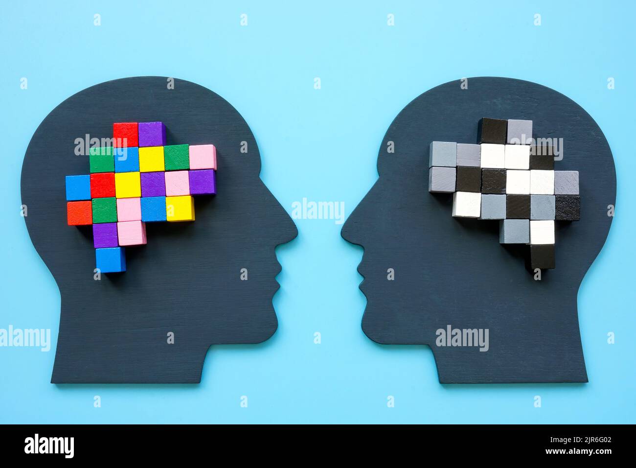 Positive and negative thinking concept. Heads and brain from colored