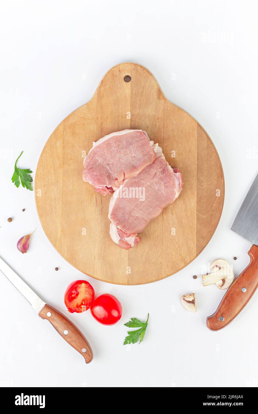 Fresh meat ready to cook with Ingredient - garlic, tomato, spice, pepper, champignon. Cooking concept Stock Photo