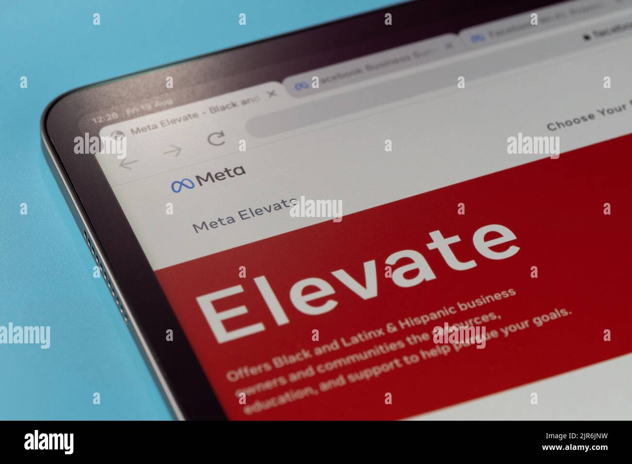 New york, USA - august 20, 2022: Browsing Meta Elevate service on tablet screen macro close up view in blue background Stock Photo