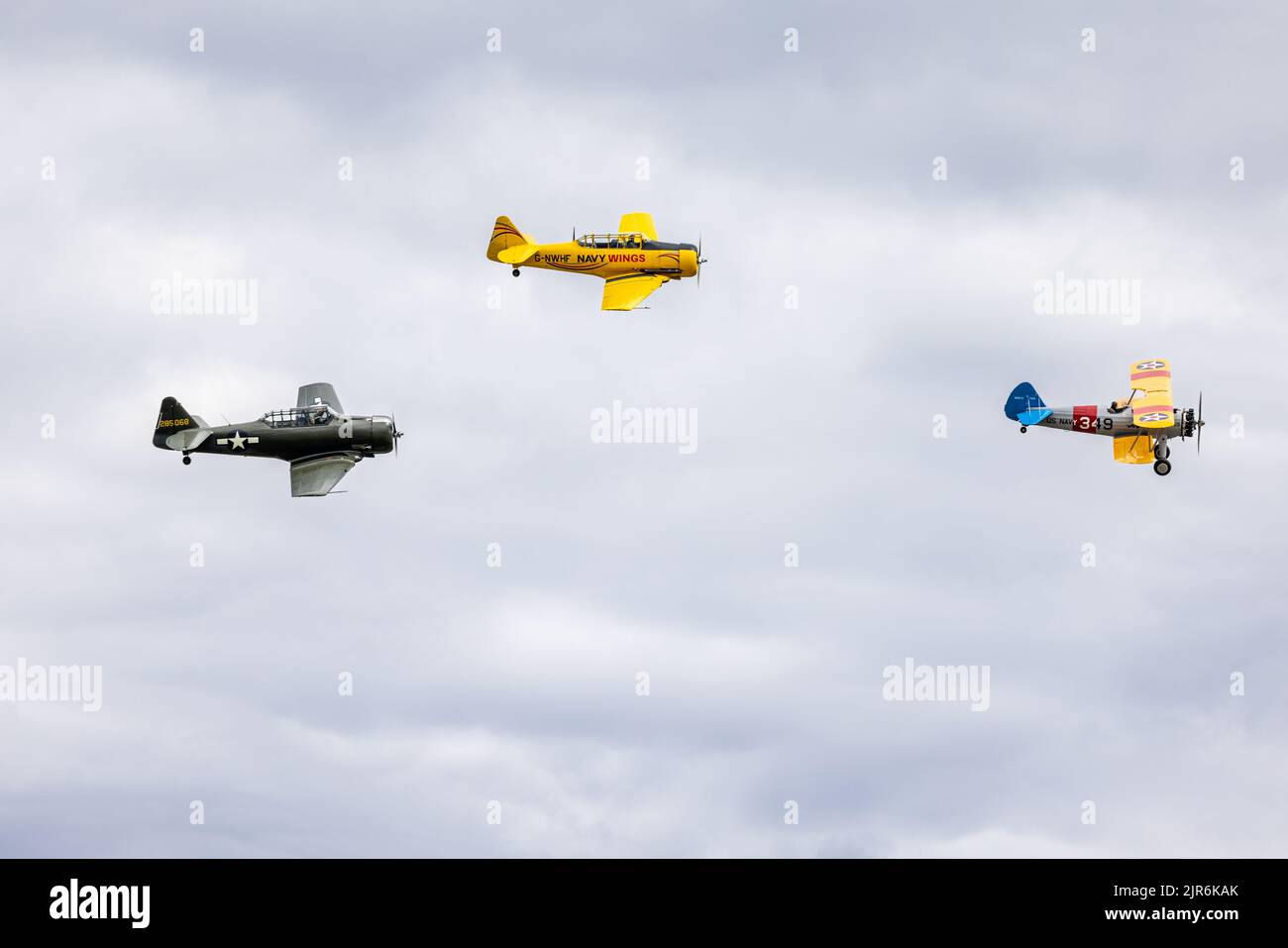 North American AT-6 Texan, Harvard T-6 & Boeing Stearman airborne at the Fly Navy Airshow held at Shuttleworth on the 3rd July 2022 Stock Photo