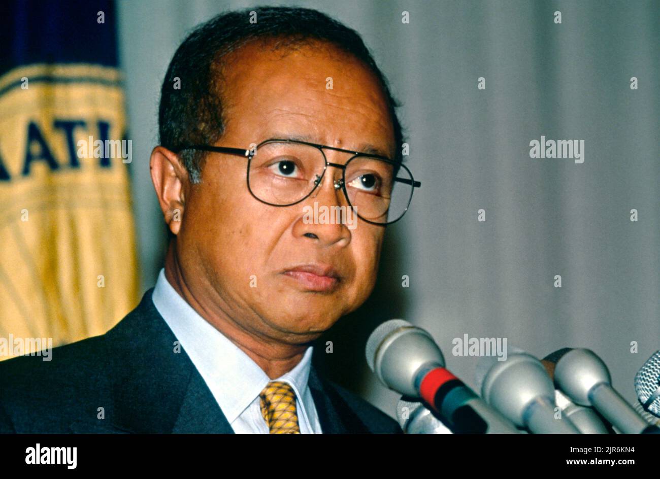 Exiled Cambodian leader Prince Norodom Ranariddh, listens to a question during a news conference at the National Press Club, July 10, 1997, in Washington, D.C. Ranariddh, was ousted in a power struggle by Khmer Rouge leader Hun Sen, and is seeking assistance in restoring the power-sharing arrangement in Phnom Penh. Stock Photo