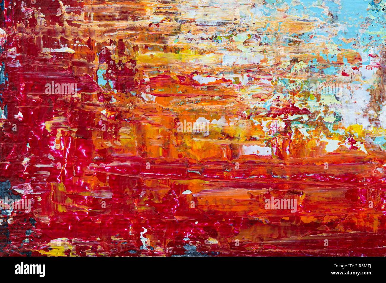 Macro close-up of an abstract and messy colorful acrylic paint