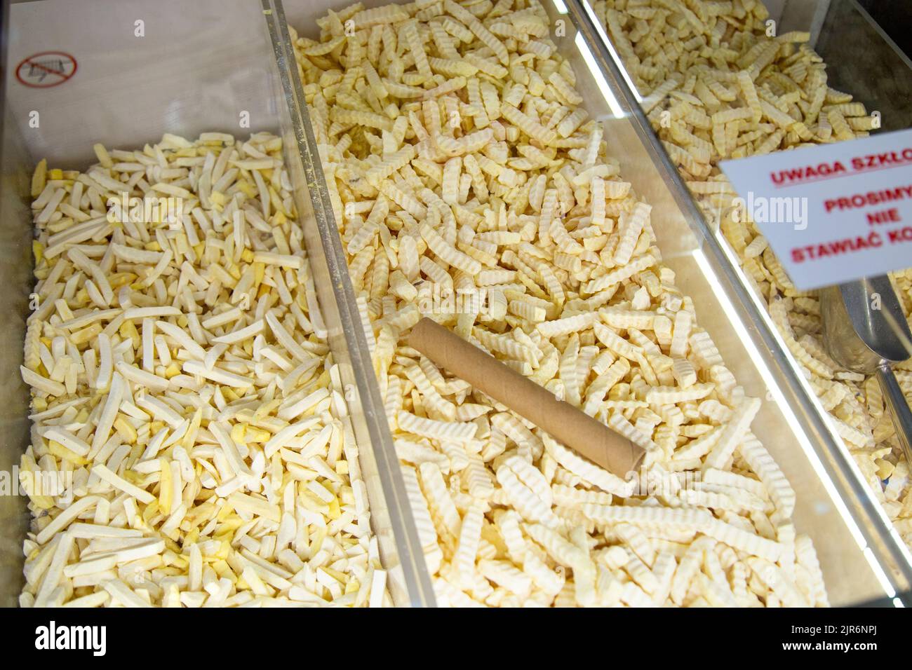 Large supermarket Carrefour in Warsaw, Poland offering loose weight, plastic free frozen food - chips Stock Photo