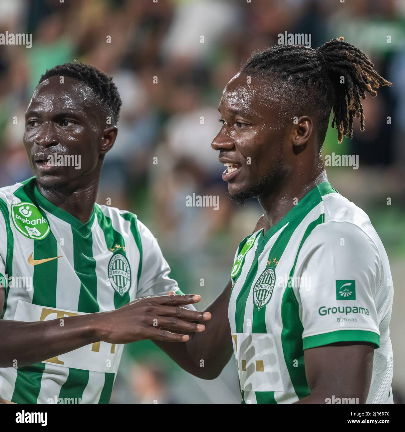 Budapest, Hungary – July 13, 2022. Ferencvaros players Adama Traore and Fortune Bassey celebrating Bassey’s goal in UEFA Champions League qualificatio Stock Photo