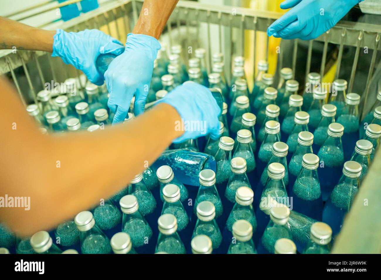 Engineer working at Fruit juice Bottle Automated conveyor belt
