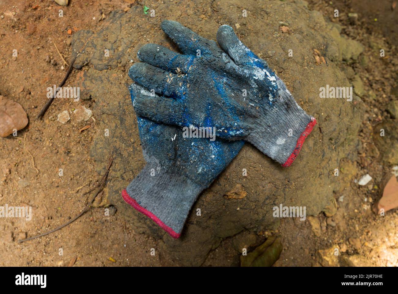 Construction worker, Gardner, painter, gloves worn out due to heavy work Stock Photo