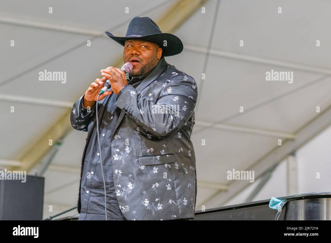 NEW ORLEANS, LA, USA - APRIL 29, 2022: Michael Trotter Jr. of War and Treaty performs during the 2022 New Orleans Jazz and Heritage Festival Stock Photo