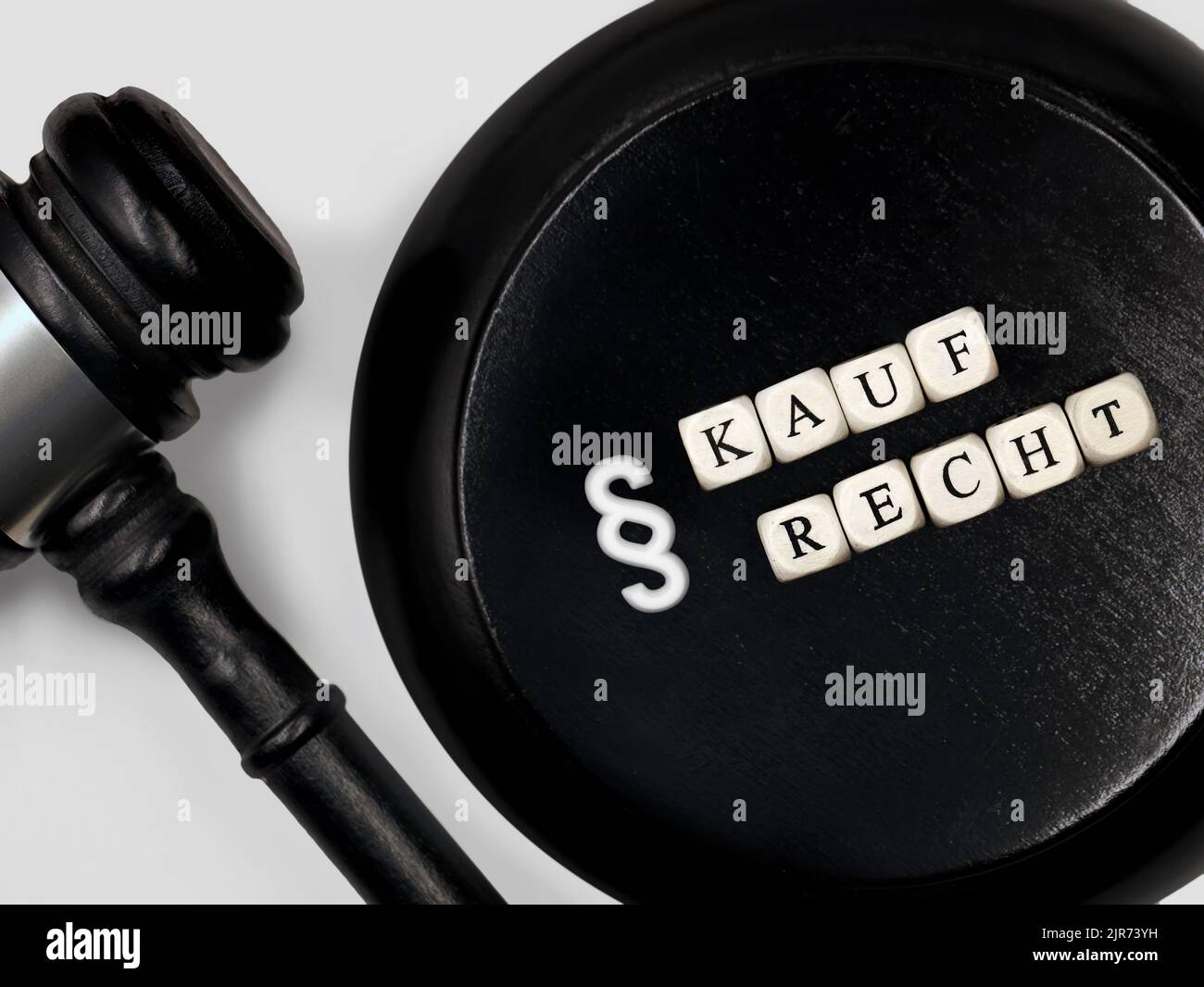 Judge gavel with round block and the german word Kaufrecht for purchase right with paragraph symbol Stock Photo