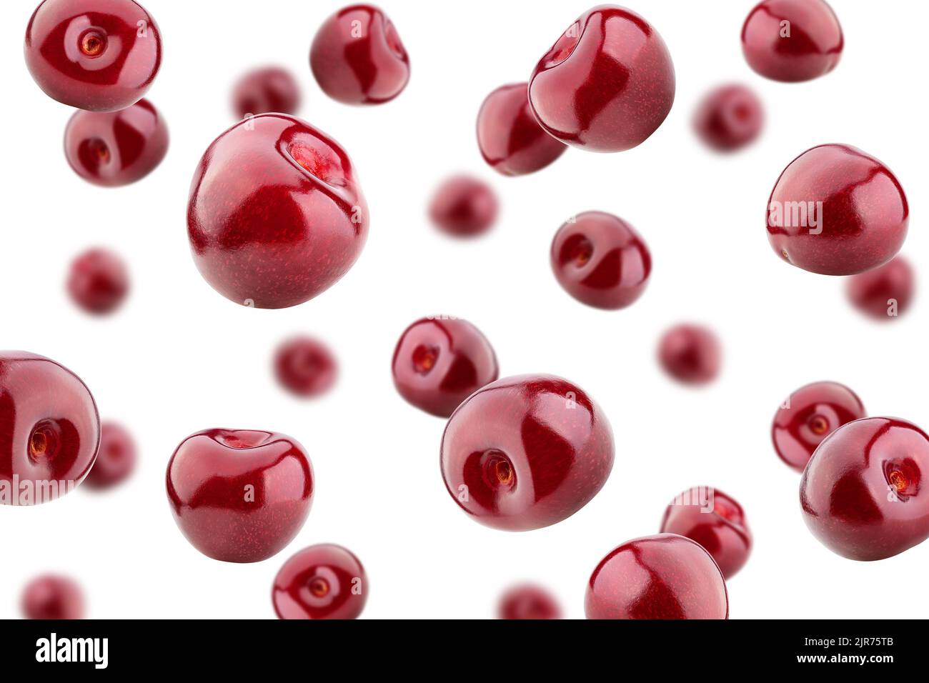 Falling cherry isolated on white background, selective focus Stock Photo
