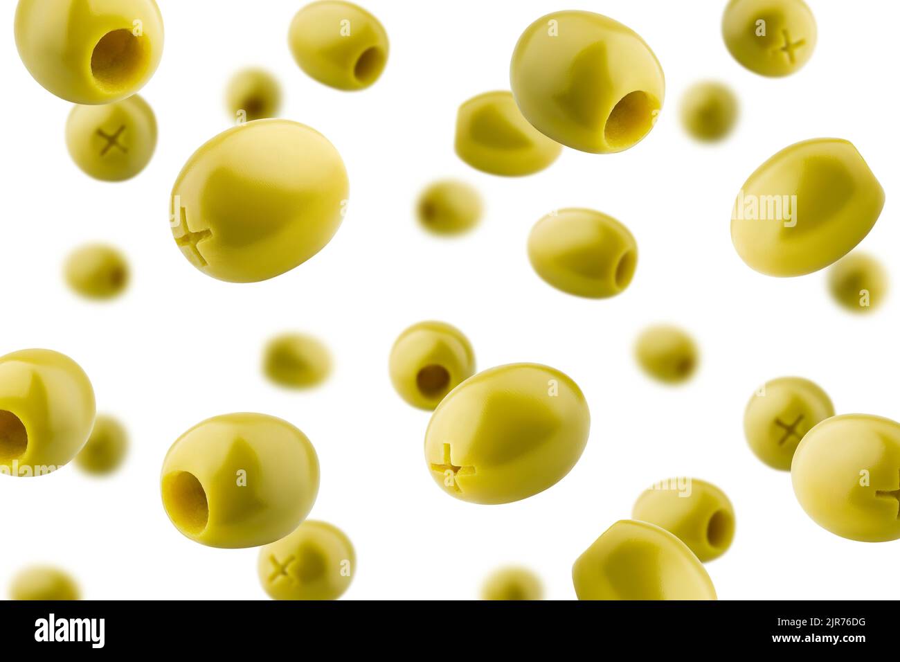 Falling pitted olive isolated on white background, selective focus Stock Photo