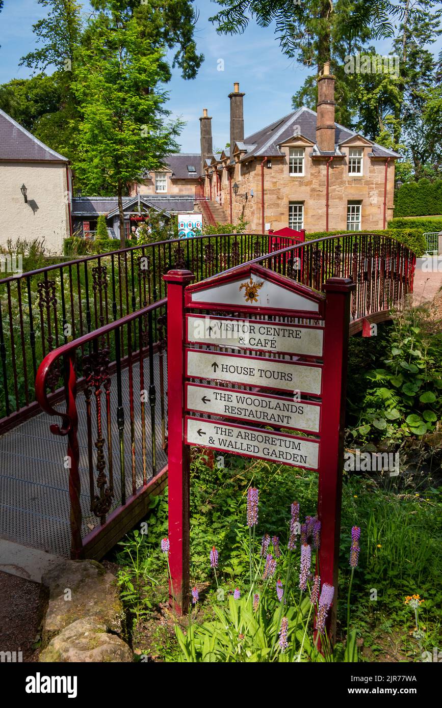 dumfries house signpost for tourists and visitors with a bridge over a stream in the estate grounds, palladian manor house in ayrshire dumfries house Stock Photo