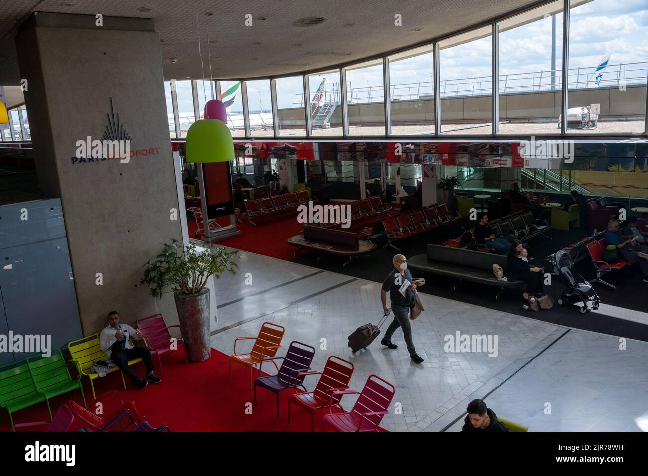 Roissy-en-France, France - 27 June 2022: Passengers waiting for their flights inside Roissy - Charles de Gaulle airport Stock Photo