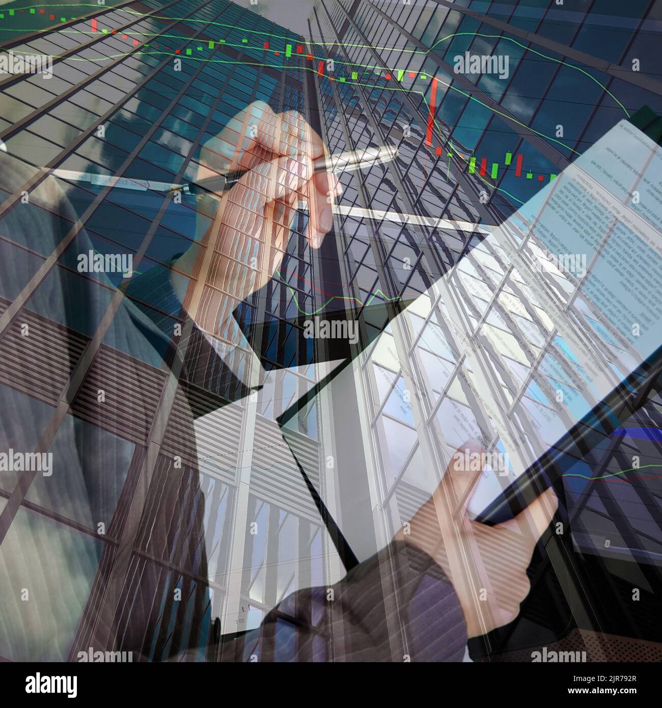 Financial candlestick chart with white caucasian hands holding a finance report and pencil with a office district in the background Stock Photo