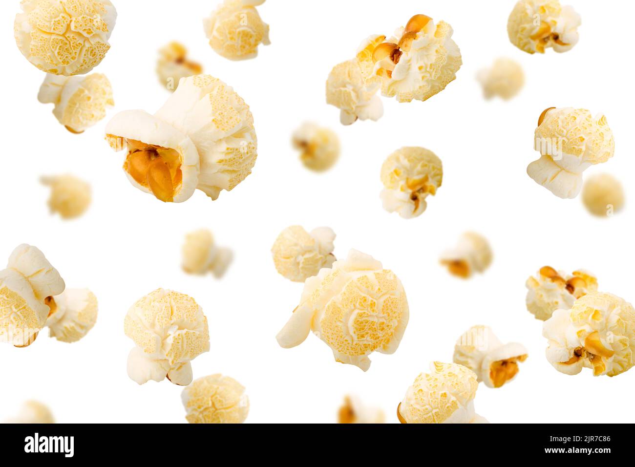Falling popcorn, isolated on white background, selective focus Stock
