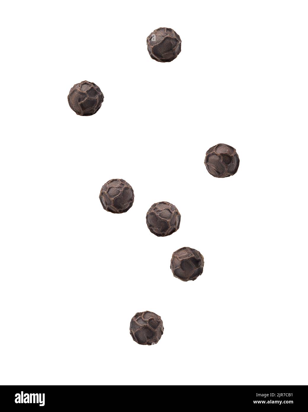 Falling black pepper, peppercorn, isolated on white background