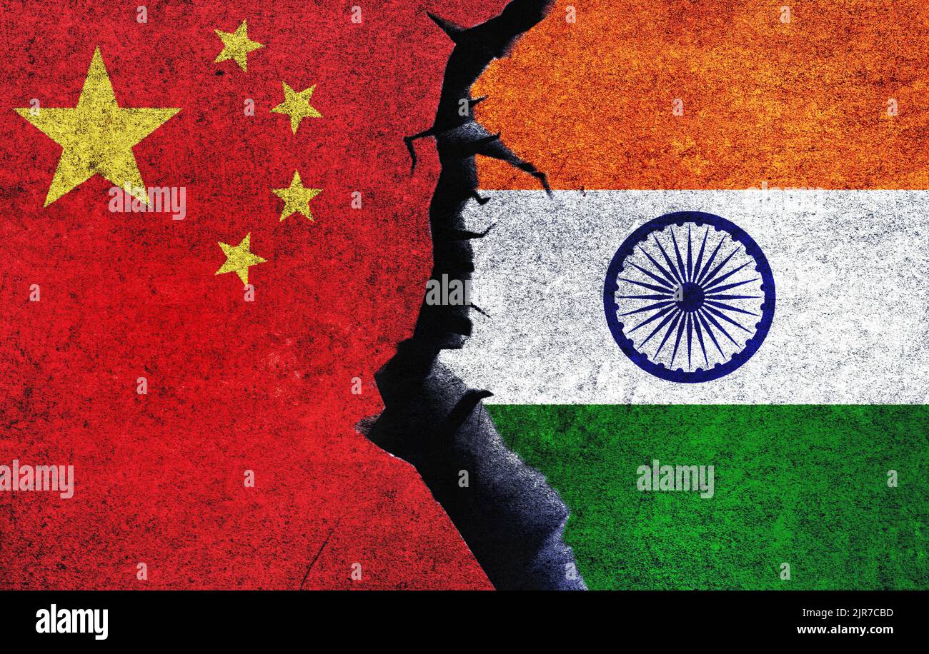 India vs China concept flags on a wall with a crack. China and India war crisis, political conflict, economy, relationship, trade concept Stock Photo