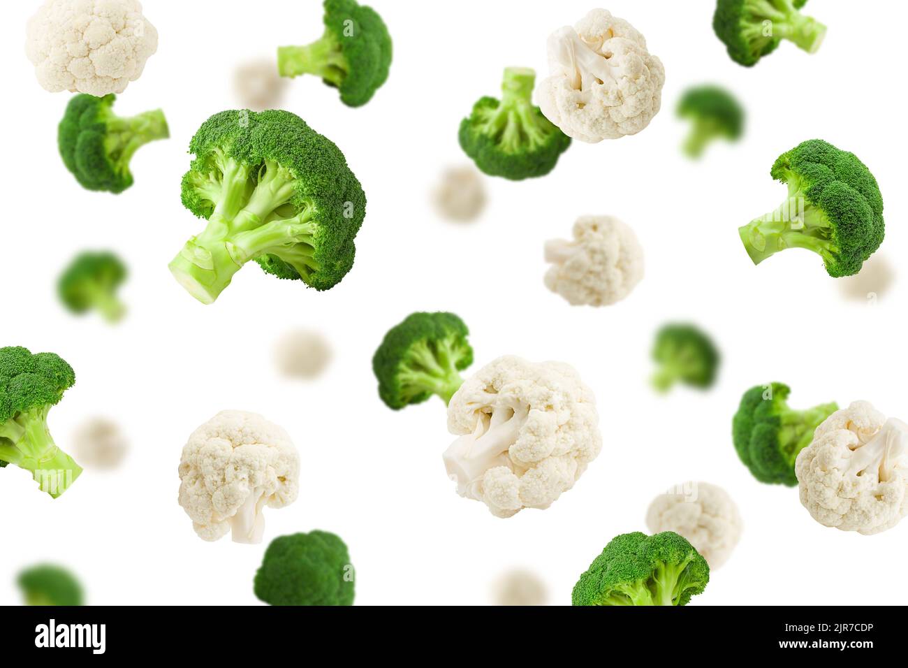 Falling cauliflower and broccoli, isolated on white background, selective focus Stock Photo