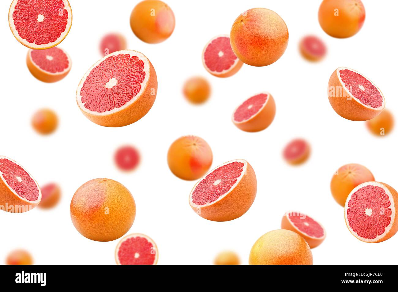 Falling grapefruits isolated on white background, selective focus Stock Photo