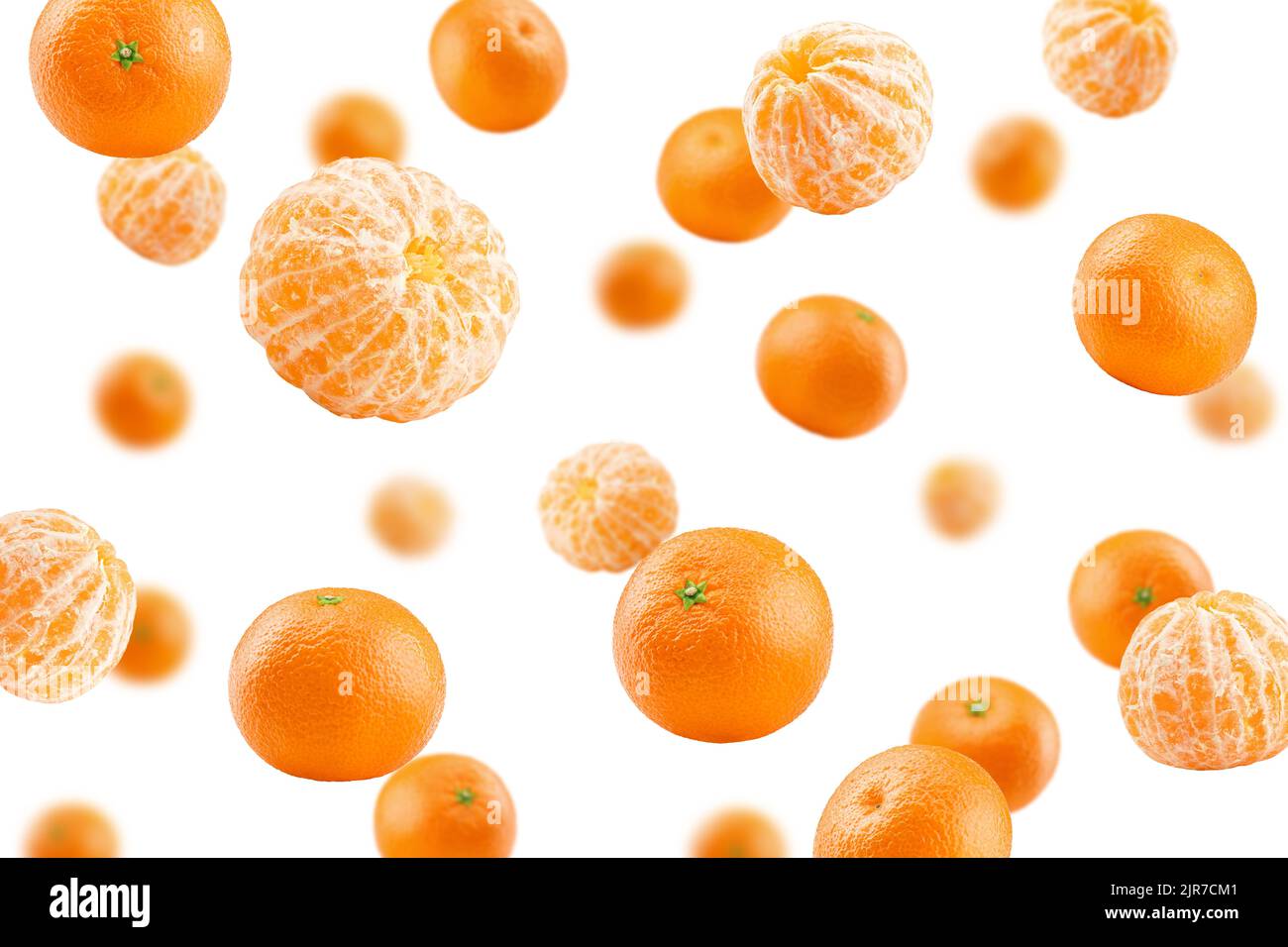 Falling mandarin, tangerine, isolated on white background, selective focus Stock Photo