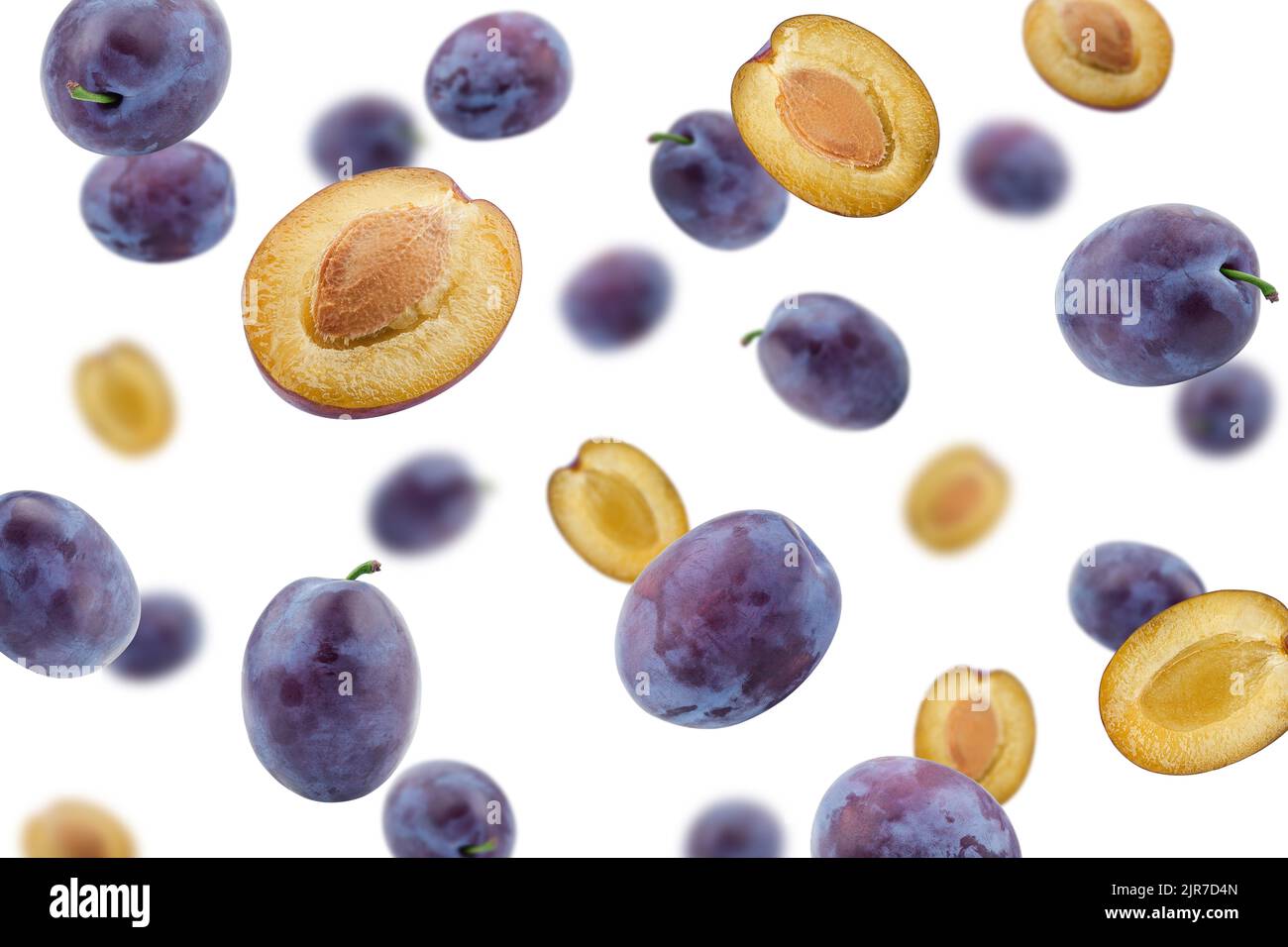 Falling plum isolated on white background, selective focus Stock Photo