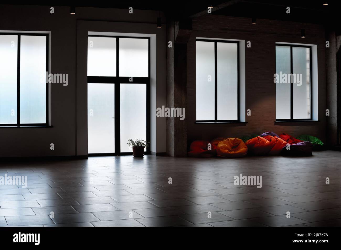 Empty room with colorful bean bags chairs Stock Photo Alamy