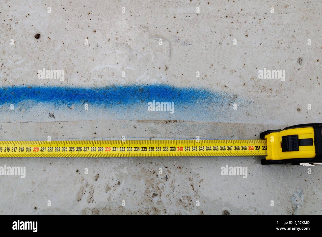 Measuring ruler on a concrete wall texture. The concept of renovation ...