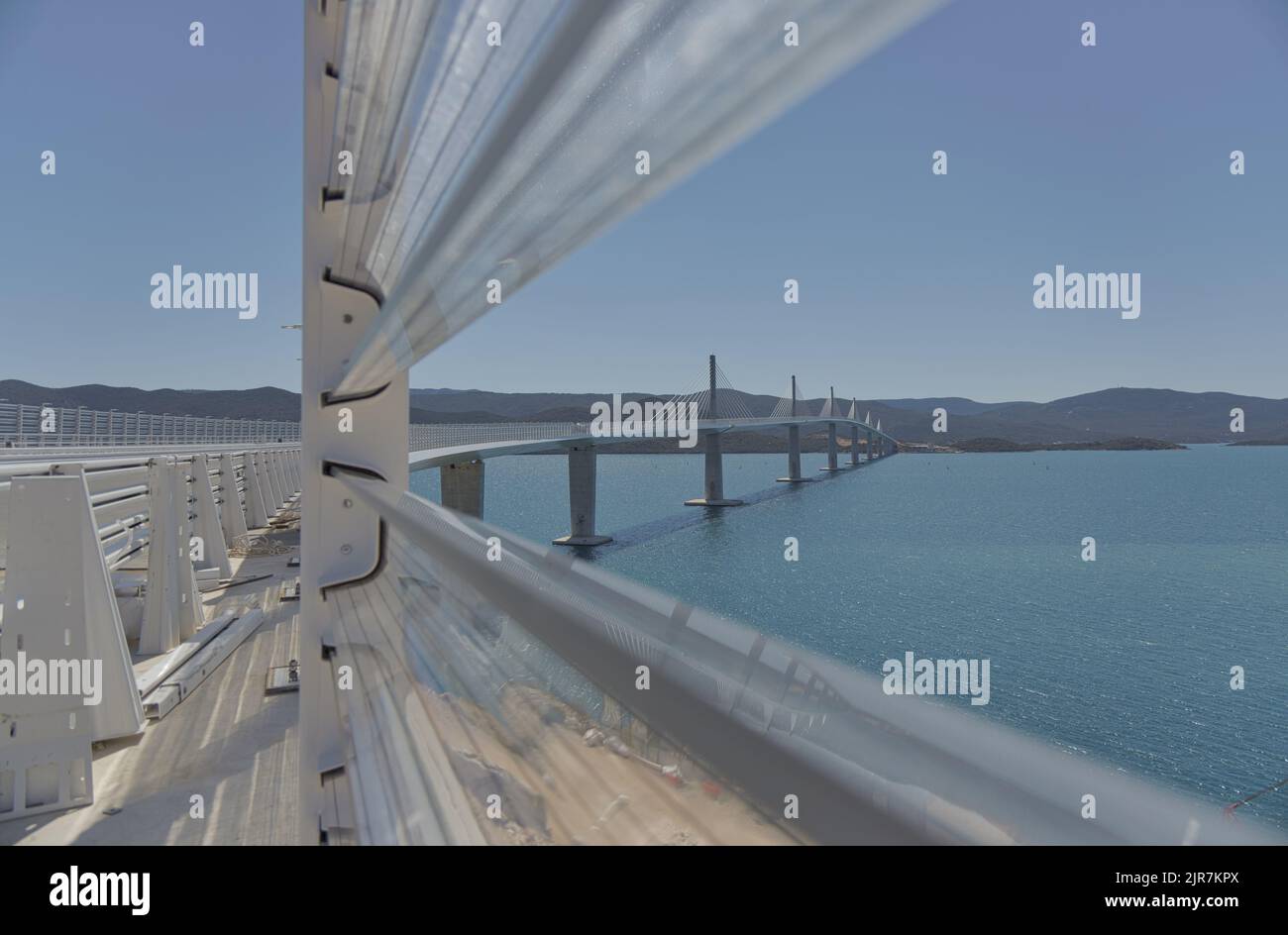 Bridge Through View View towards the bridge through the industrial plastic fence Stock ...