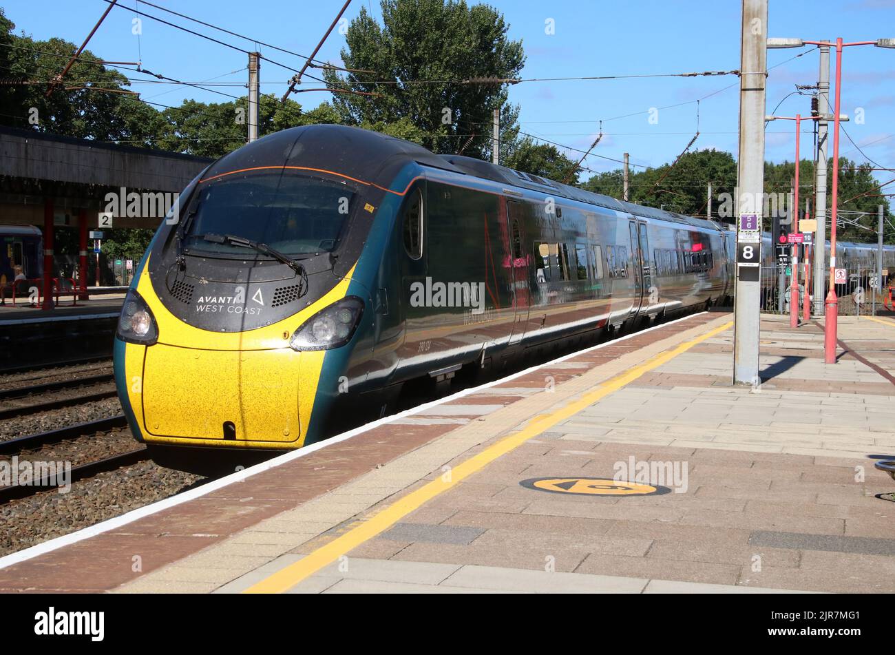 Avanti West Coast class 390 pendolino electric train arriving at Lancaster railway station on the West Coast Main Line on 17th August 2022. Stock Photo