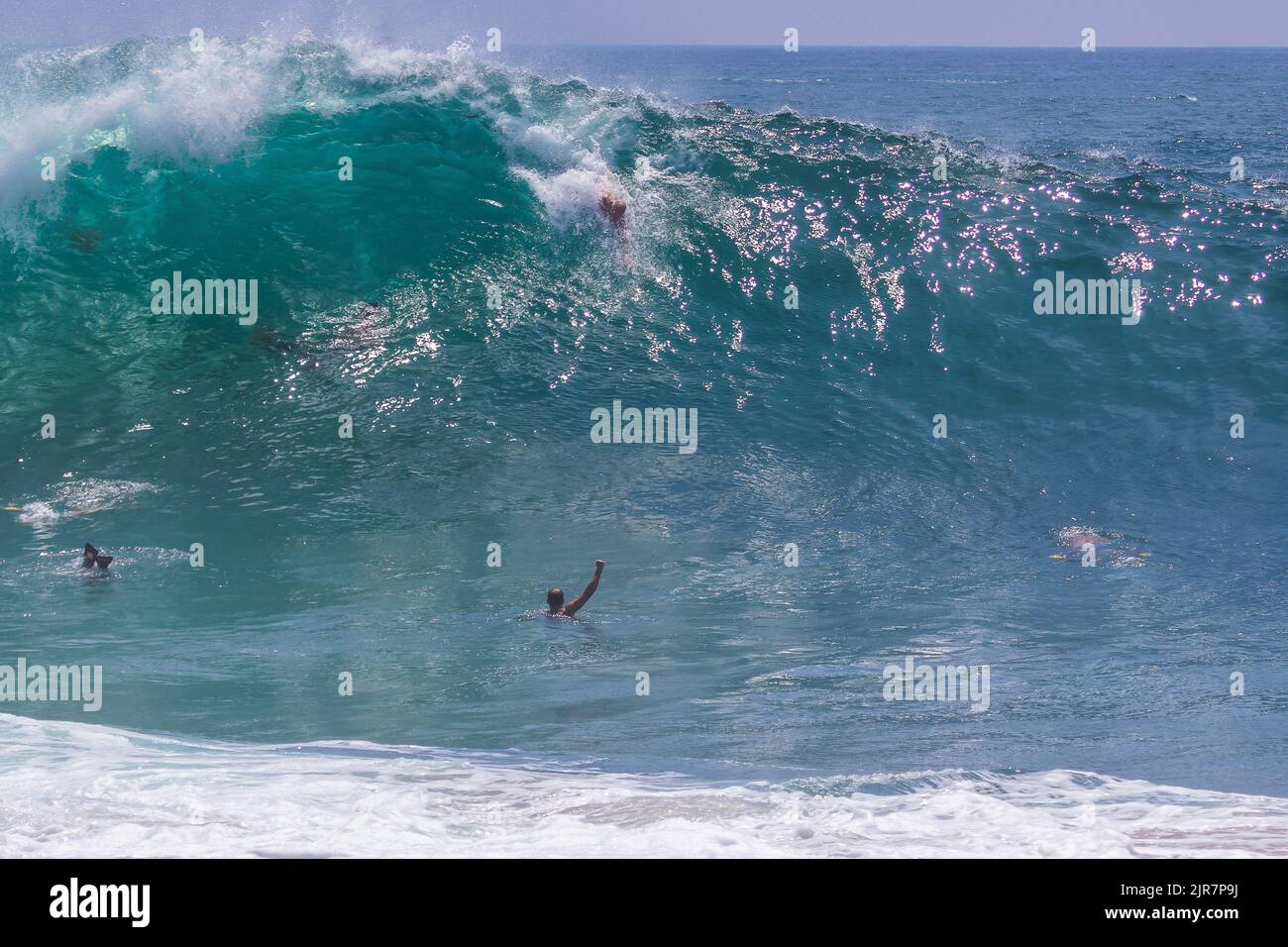 Body surfers riding big crashing waves at the Wedge, Newport Beach , California Stock Photo