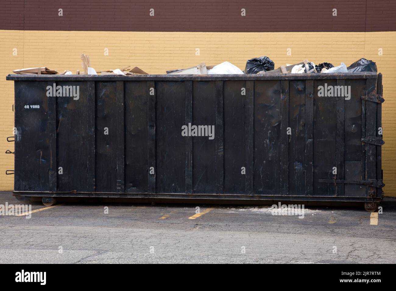 40 cubic yard dumpster container full of garbage. Stock Photo