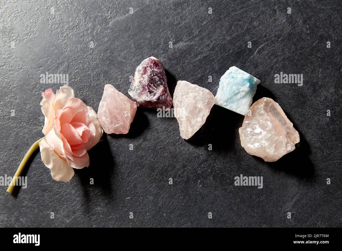 quartz crystals, gem stones and rose flower Stock Photo - Alamy