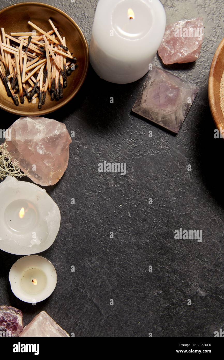 burning candles and crystals for magic ritual Stock Photo Alamy