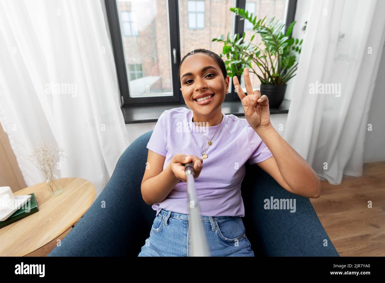 happy african american woman taking selfie at home Stock Photo - Alamy