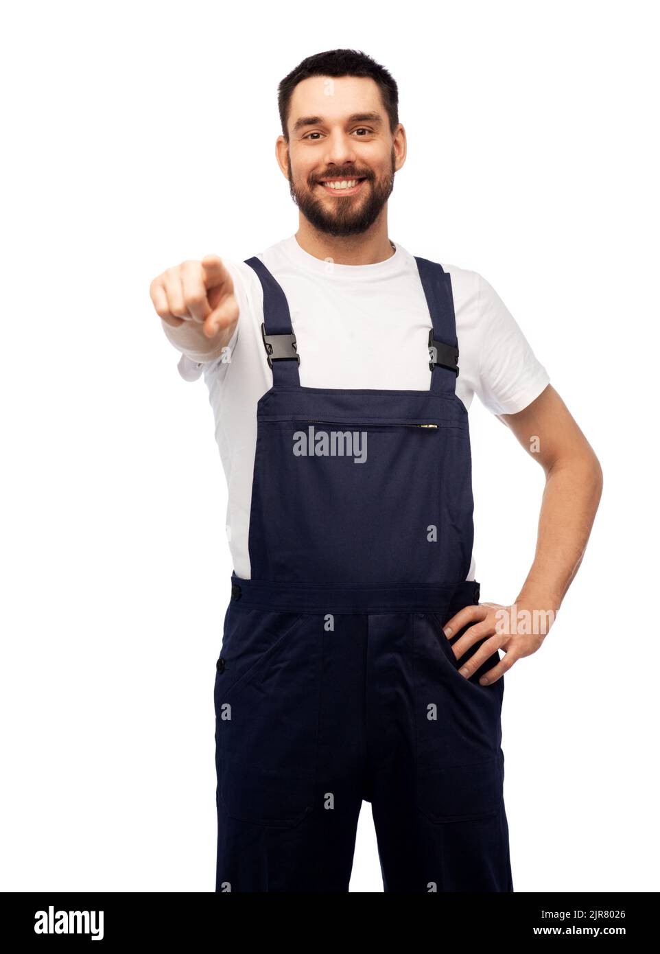 smiling male worker or builder pointing to camera Stock Photo
