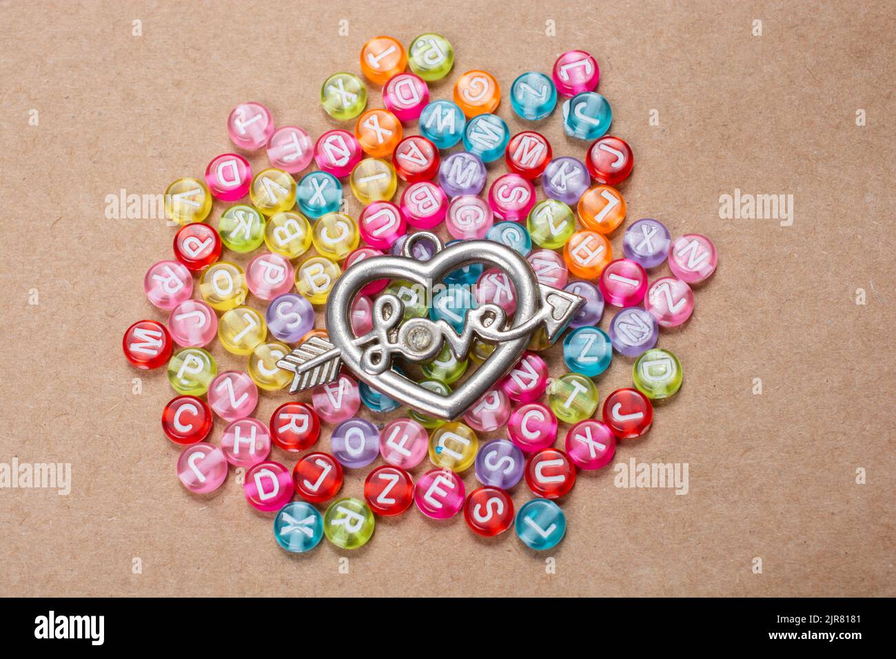 Heart shape and love wording amid colorful alphabet letters Stock Photo ...