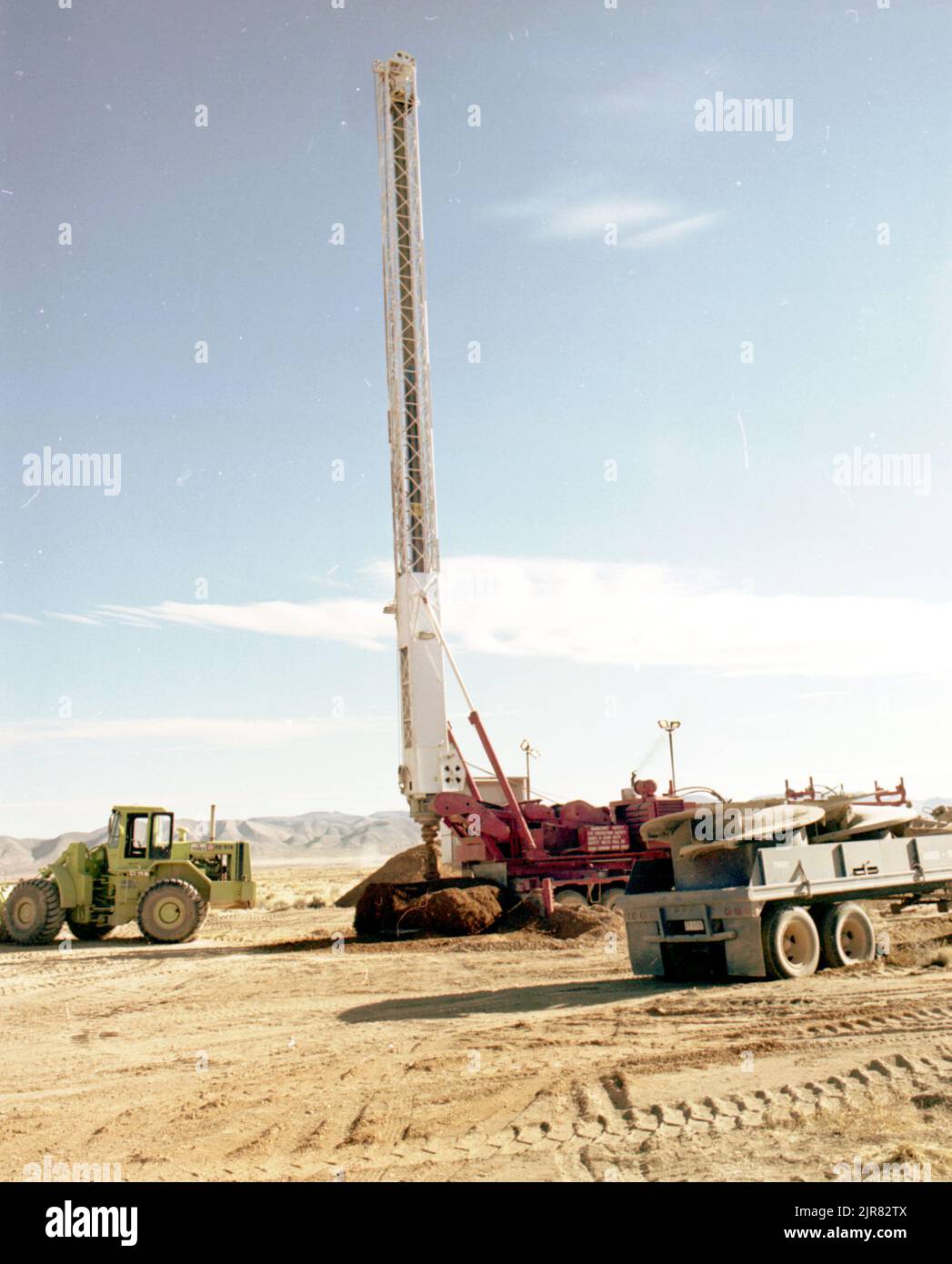A810114 DRILL RIGS DRILL RIGS J. BARTLETT (Project Engineer) JAN 13 81 EG&G/NTS PHOTO LAB Publication Date: 1/13/1981  AUGER #2; BARTLETT, J.; DRILLING RIGS; DRILLS; EDGERTON, GERMESHAUSEN & GRIER; EG&G; EQUIPMENT & INSTRUMENTS; EQUIPMENT (SNL); MINING; NEVADA; NEVADA TEST SITE; NTS; NUCLEAR ENERGY TECHNOLOGY; NUCLEAR TESTING; RIGS; TEST SITES; TRAILERS, MOTOR DRAWN; TUNNELING; UGT; UNDERGROUND TESTING; DRILL RIGS  historical images. 1972 - 2012. Department of Energy. National Nuclear Security Administration. Photographs Related to Nuclear Weapons Testing at the Nevada Test Site. Stock Photo