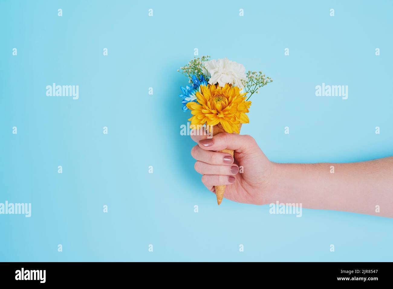 Who says you cant have flowers and eat it too. an unrecognizable woman