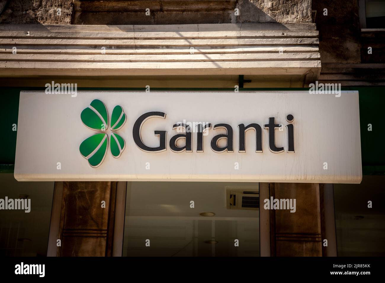 Picture of a sign with the logo of Garanti Bankasi taken in front of their local bank in Istanbul, Turkey. Garanti BBVA (legal name Türkiye Garanti Ba Stock Photo
