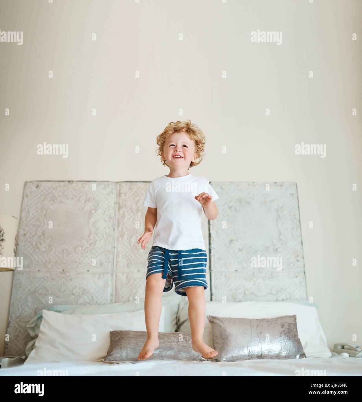 Such joy just jumping on a bed brings him. an adorable little boy