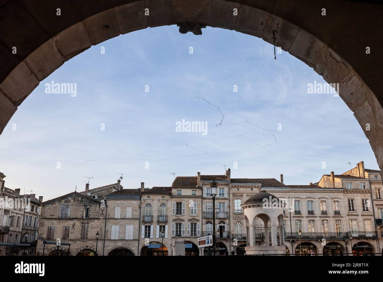 Picture of the cityscape of Libourne, France, with a focus on place Abel Surchamp square, a typical medieval square street, in the city center. Libour Stock Photo