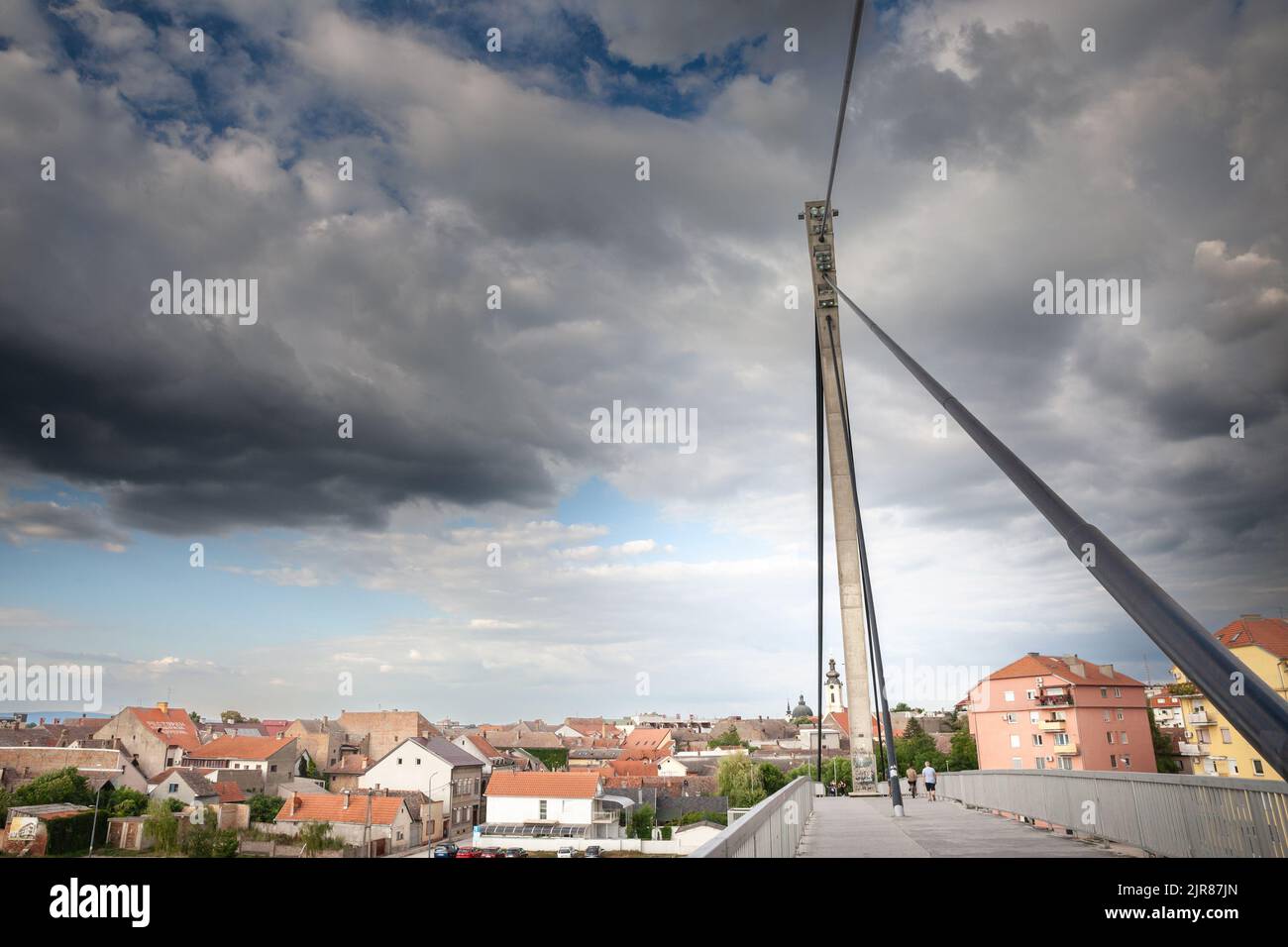 Picture of a Suspended Bridge in the city of Sremska Mitrovica, in northern Serbia, crossing the river Sava, with the city center of the city in  Srem Stock Photo