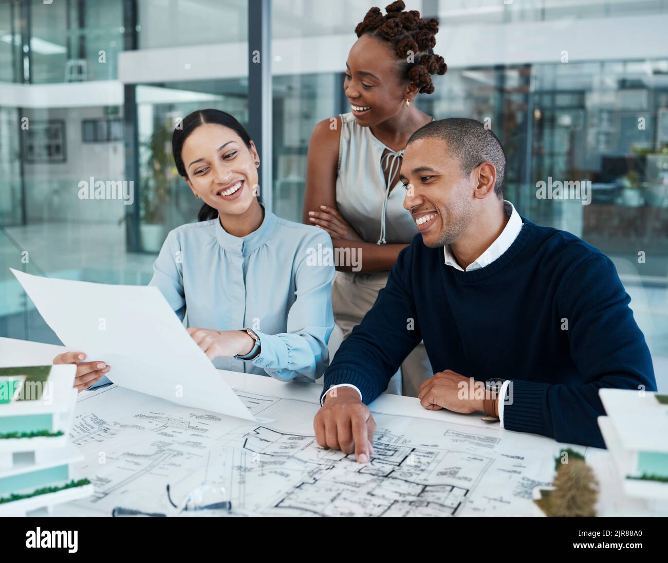 3d industrial architecture design and engineer planning collaboration and building model for construction in creative studio. Happy designer and Stock Photo
