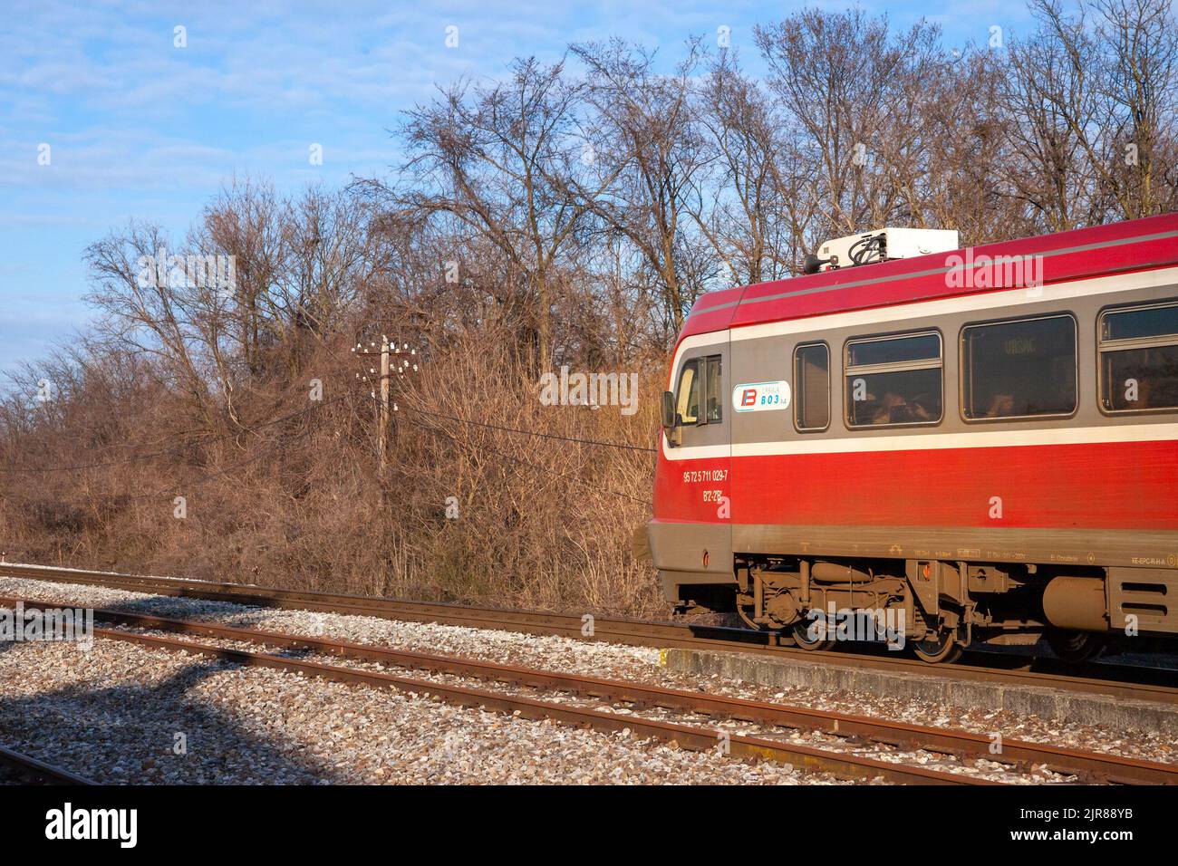 Picture of a train crossing the city of banatsko novo selo, Serbia, operated by Srbija voz, the national passenger railways of Serbia. Stock Photo