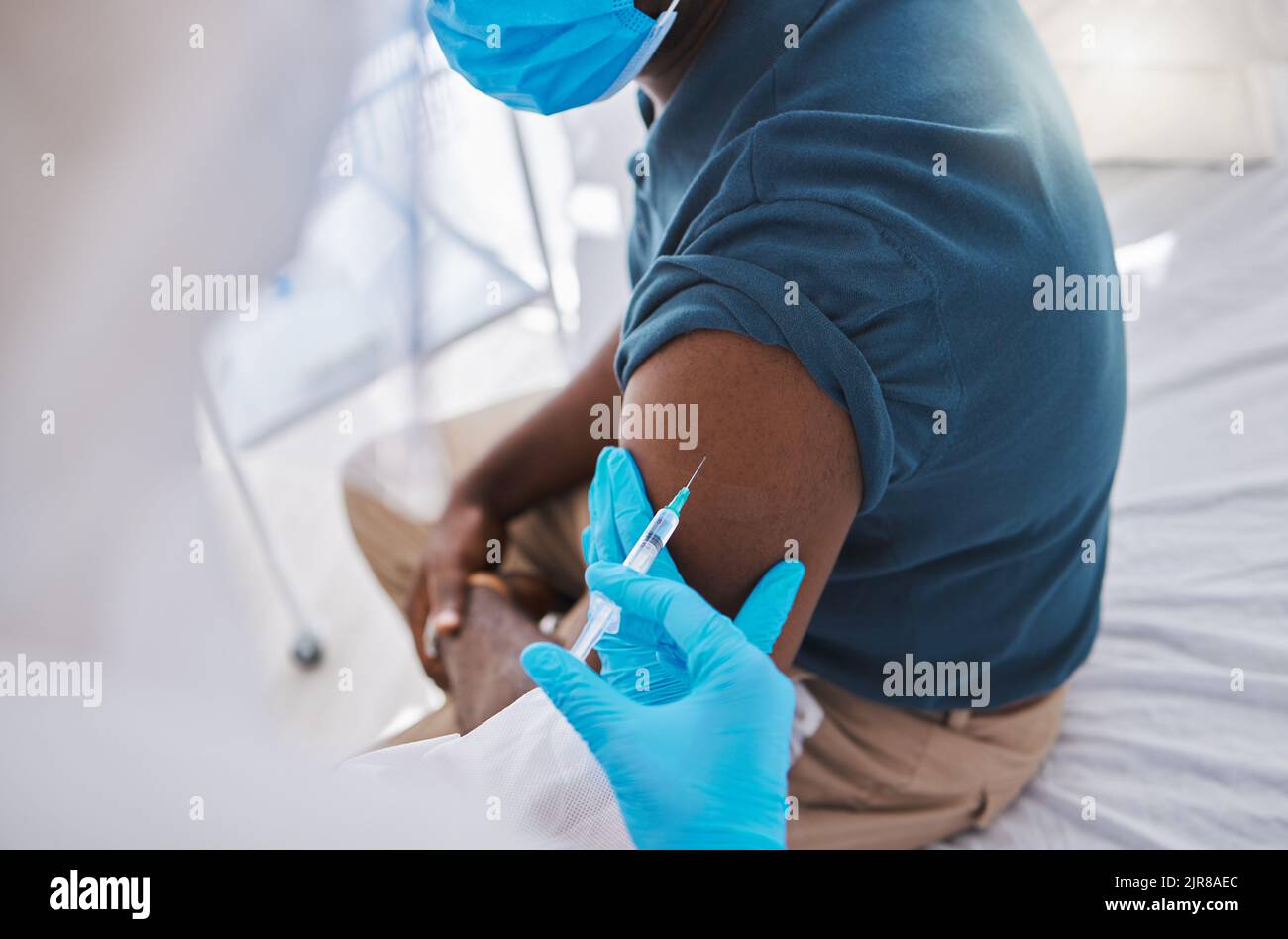 Vaccine, injection or medicine cure for covid, monkeypox and ebola with trust doctor, healthcare or medical worker. Physician in hazmat suit with Stock Photo
