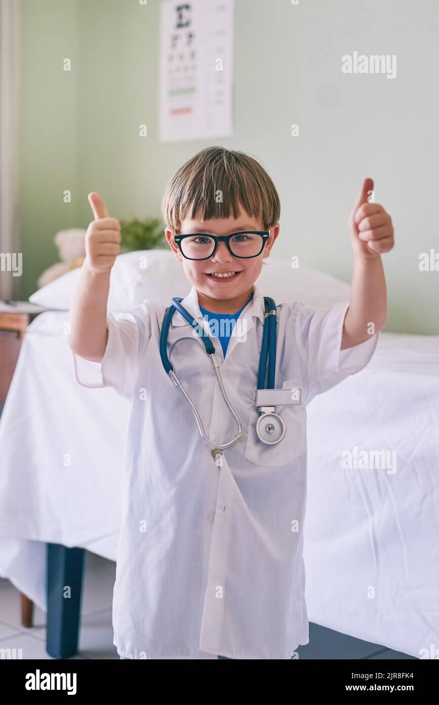 I see doctors as role models. an adorable little boy dressed as a