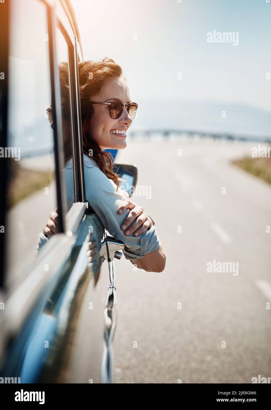 I love feel the breeze against my face. an attractive woman hanging out ...