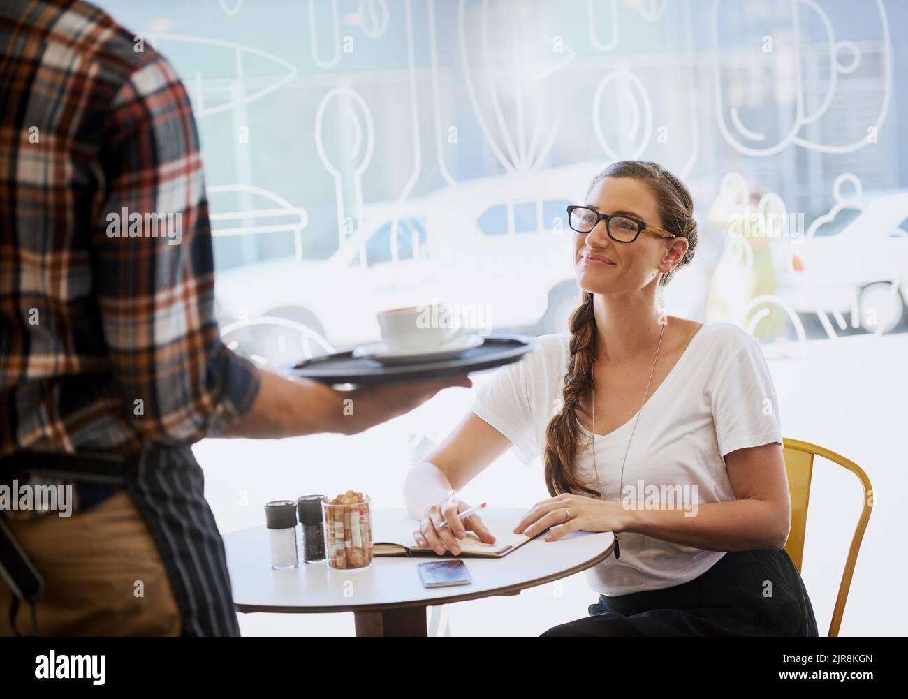 Serving up a cup of inspiration. an unidentifiable waiter serving