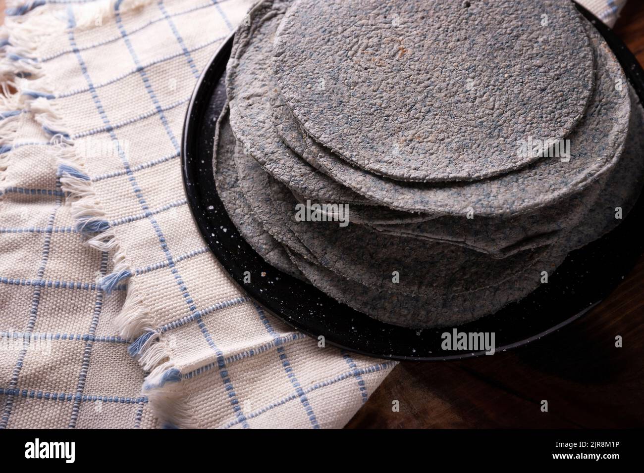 Blue Corn Tortillas. Food made with nixtamalized corn, a staple food in