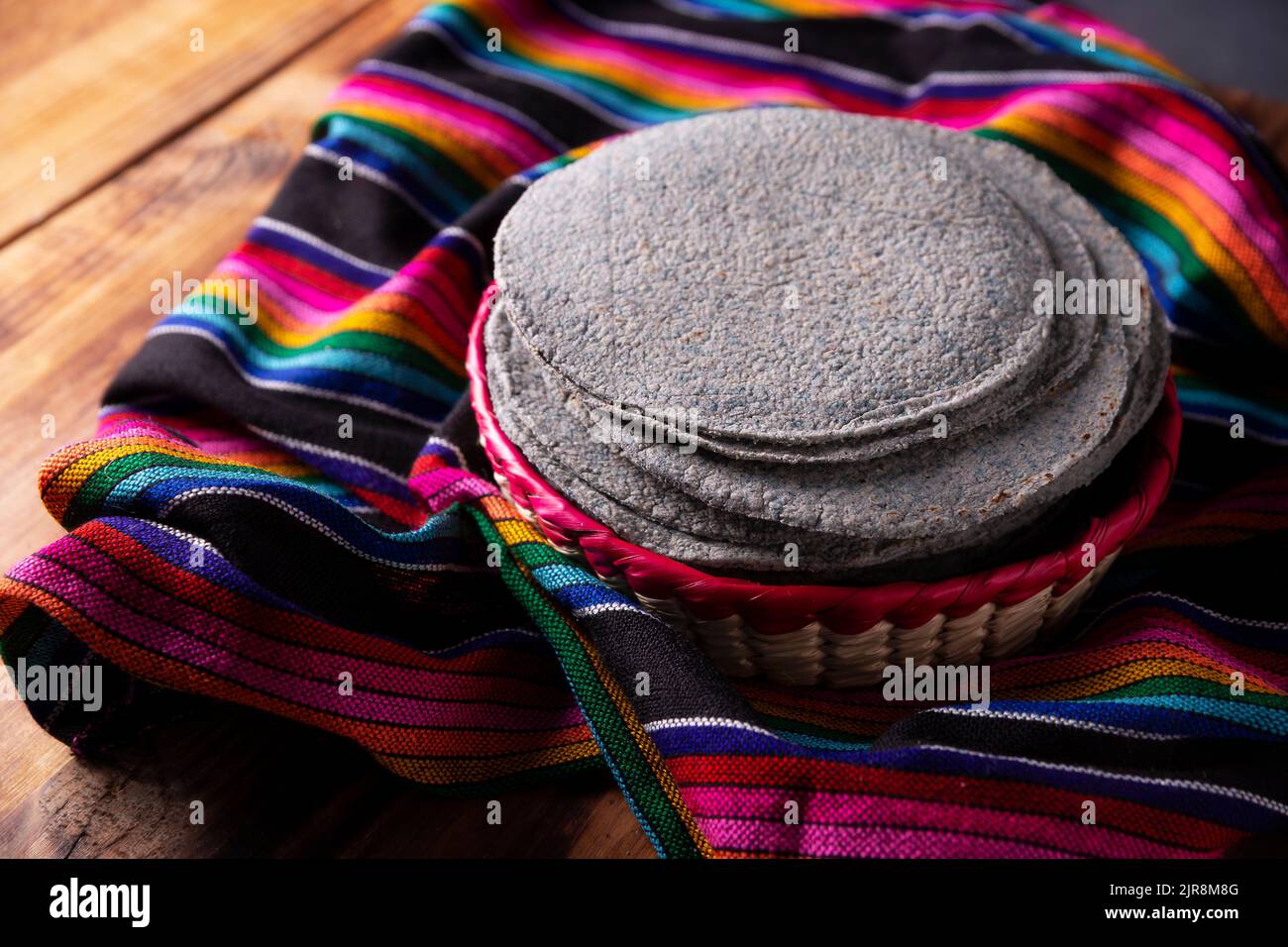 Blue Corn Tortillas. Food made with nixtamalized corn, a staple food in several American countries, an essential element in many Latin American dishes Stock Photo